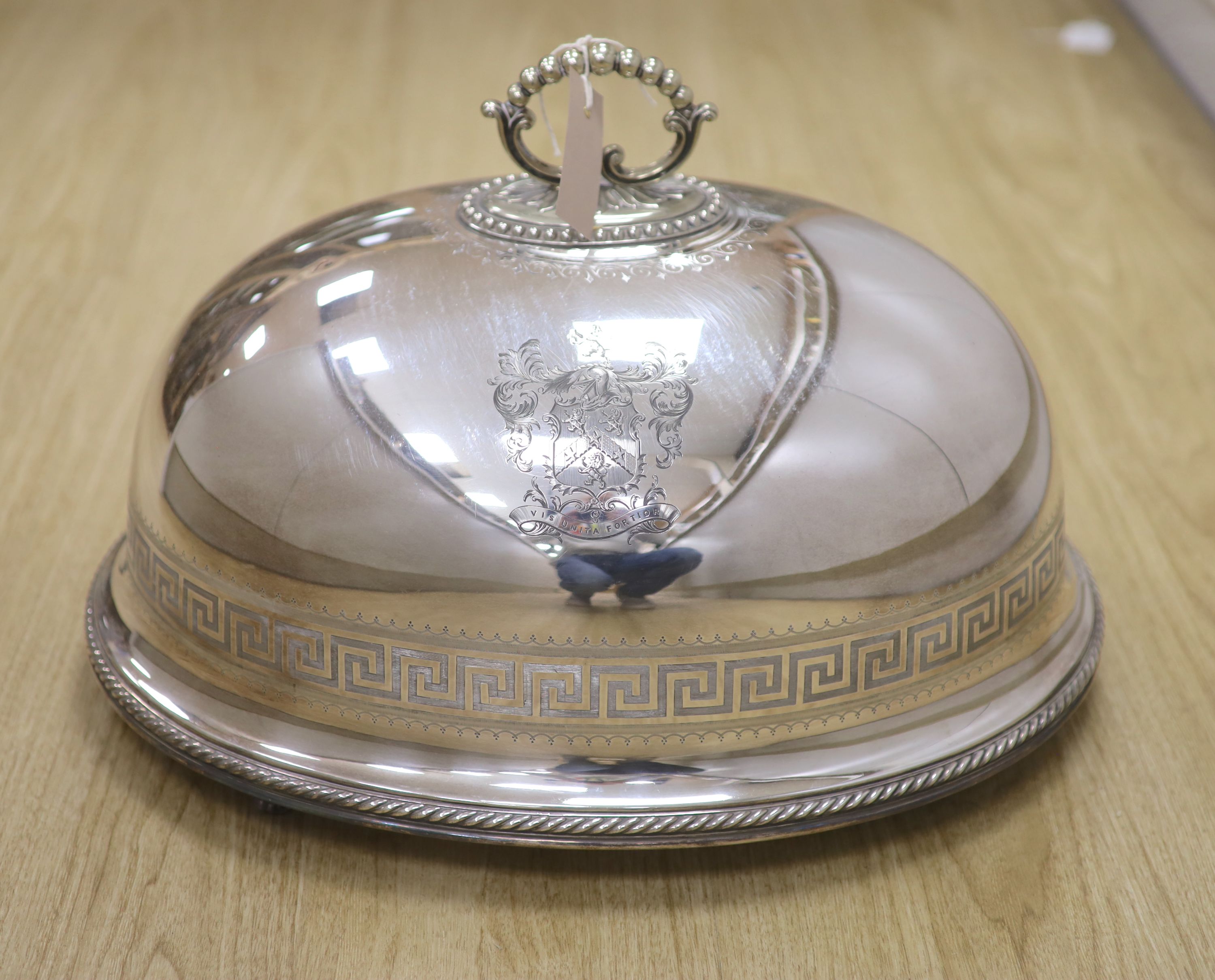 A Victorian electro-plated meat cover by Elkington having Greek key pattern and armorial, with associated venison dish, overall height